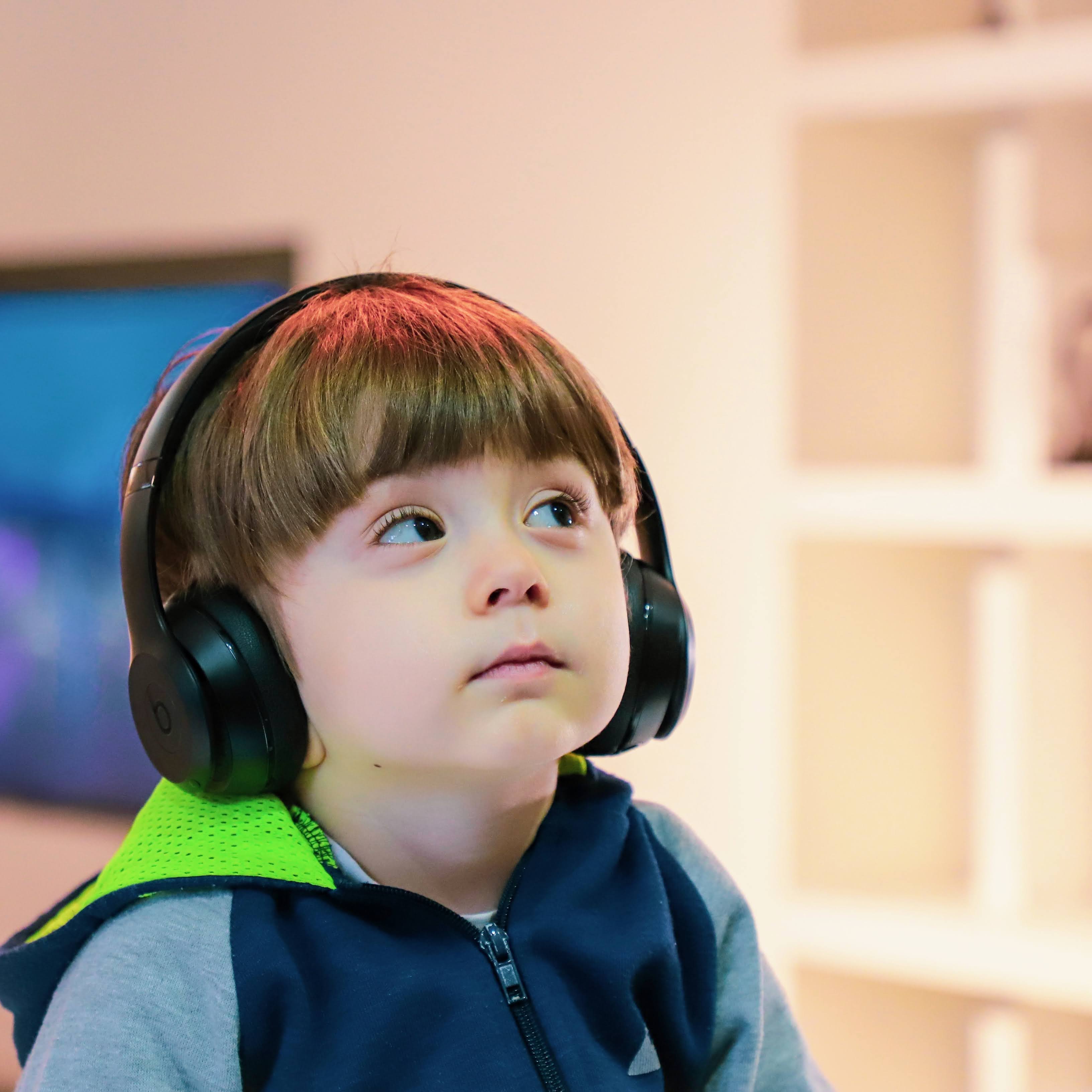 Child with Headphones listening