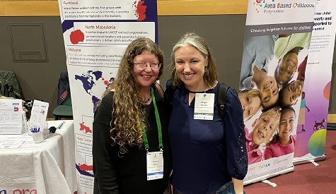 Bergen Nelson and Christine Spence standing in front of mental health posters