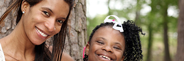 African American woman with African American Autistic young girl